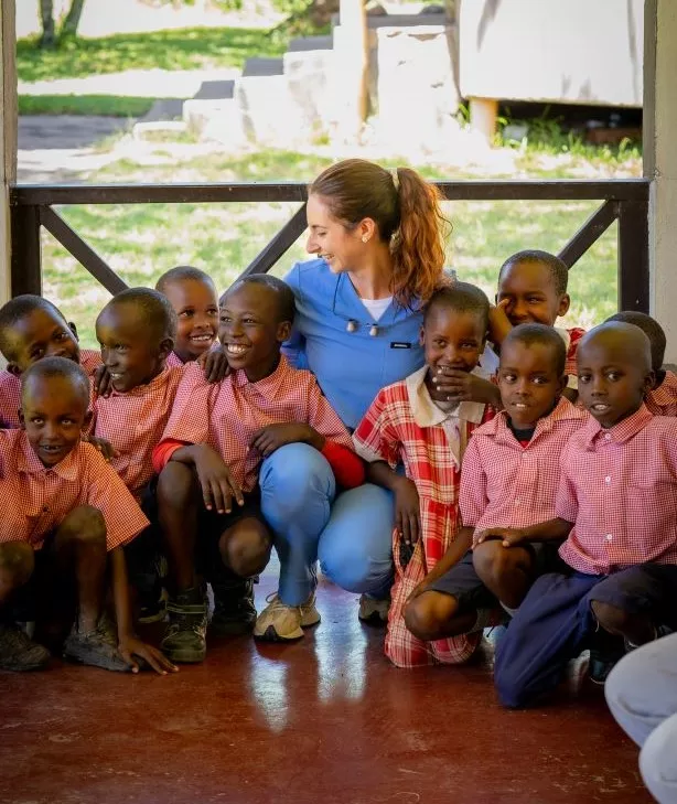 Dr. Raptis with the children of the Maasai Clinic in Kenya with her Orascoptic Dental Loupes.